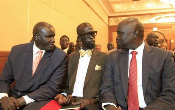 Grang Demebiar, son of late Sudanese politician John Garang, talks to unidentified members of South Sudan rebel delegation during opening ceremony of South Sudan's negotiation in Addis Ababa