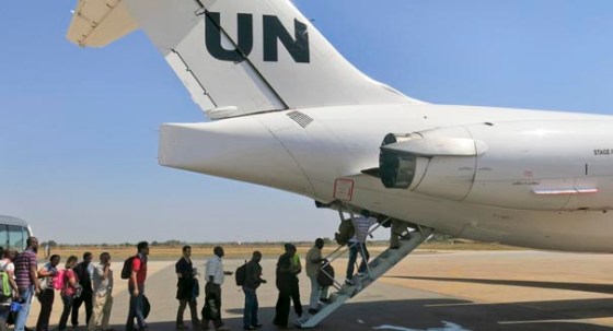In this photo taken Sunday, Dec. 22, 2013 and released by the United Nations Mission in South Sudan (UNMISS) on Monday, Dec. 23, 2013, UNMISS relocates non-critical staff from Juba, South Sudan, to Entebbe, Uganda. Civilian helicopters evacuated U.S. citizens from the violent South Sudan city of Bor, capital of Jonglei state, seeing bouts of heavy machine gun fire, but 3,000 citizens from countries like Canada, Britain and Kenya remain trapped there, a top U.N. official said Monday. (AP Photo/UNMISS, Irene Scott)