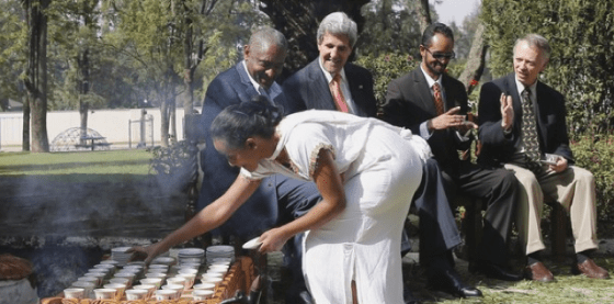 John Kerry smiling on a coffee table in Ethiopia, August 2013 (Photo: Getty images)