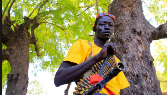 A armed civilian waits for a sign of an enemy in Bor Town on December 25, 2013(Photo credits: James Akena/Reuters)