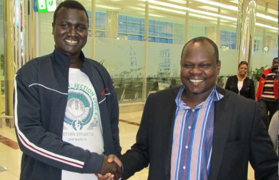 Mr. Kuer Bol shaking hands with former SG Pagan Amum(photo credit: Kuer)