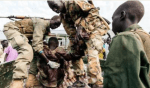 An SPLA soldier, shot in Malakal clusters earlier this year, dragged by his colleagues to safety.(Photo: past files)