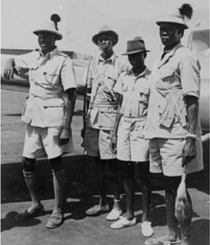 Four Nuer local government officials prior to a low-level flight over the central Nuer district in 1947, and including on the left Buth Diu, later one of the first southern members of the Legislative Assembly(Photo: Buth Diu's Wikipedia page)