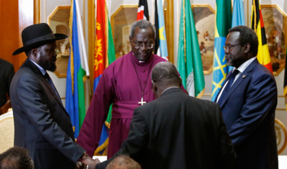 The Episcopal Archbishop of Sudan, Daniel Deng Bul, prayed and presided over the first face-to-face meeting in Addis Ababa 9 May between Salva Kiir Mayardiit, left, and Dr. Riek Machar Teny, the warring factions leaders (Photo: Goran Tomasevic/Reuters)