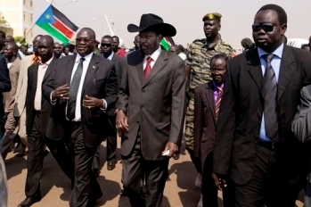 President Salva Kiir Mayardit, centre, with Vice President Dr. Riek Machar, left, and James Wani Igga, centre right, Speaker of the Legislative Assembly, at Juba airport on 8 February 2011