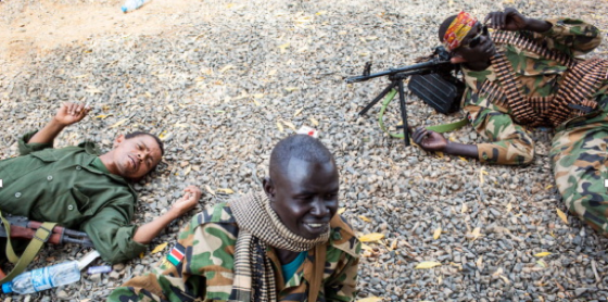 South Sudanese army soldiers take cover from the sun in the town of Paloch where one of South Sudan's last working petroleum facilities is located, on March 2, 2014.  AFP PHOTO / ANDREI PUNGOVSCHI (Photo credit should read ANDREI PUNGOVSCHI/AFP/Getty Images)