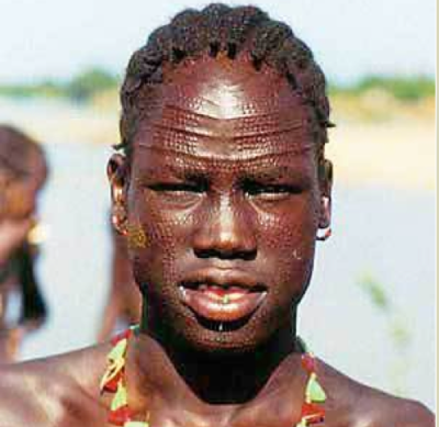 Nuer ethnic gentleman with traditional scrafications on his head and numerous marks as a passage to manhood(Photo: File|Nyamilepedia)