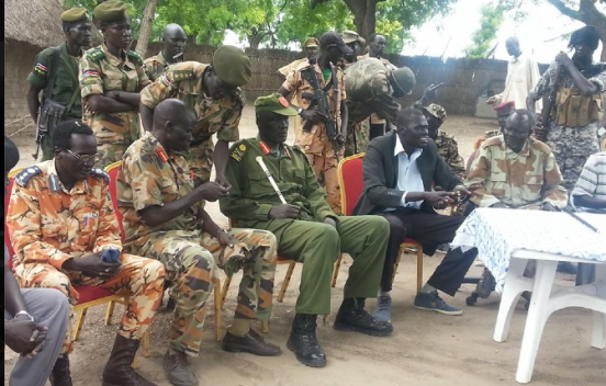 Gen. Gathoth Gatkuoth listening to Abobo's commissioner, Koang Rambang, in Akobo. (Photo credits: Yuer Dang)