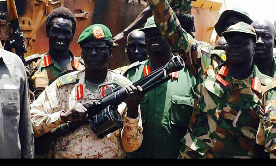 The Military Governor of Unity State, Peter Gatdet Yak and his counterpart, Maj. Gen. James Koang Chuol showing off their weapons after defeating government forces in Unity state(Photo: supplied)