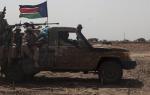 SPLA soldiers drive to the frontline at Mathiang from their military base in Bor, South Sudan, January 26, 2014. The government and rebels in South Sudan traded accusations on Saturday of breaking a ceasefire deal supposed to calm violence that has driven half a million people from their homes. Picture taken January 26, 2014. REUTERS/George Philipas (SOUTH SUDAN - Tags: CIVIL UNREST POLITICS CRIME LAW)