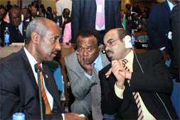 Seyoum Mesfin (left) and TPLF puppet Tekeda Alemu (center) with Meles Zenawi Posted by Tekeda Alemu