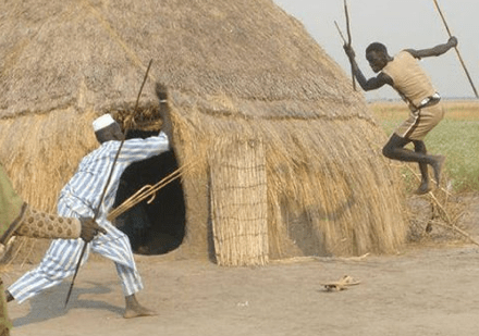 Nuer warriors demonstrating a cultural practices, aimed to highlight how men could tactically fight off a sudden attack by spears in close range (Photo: Nyamilepedia)
