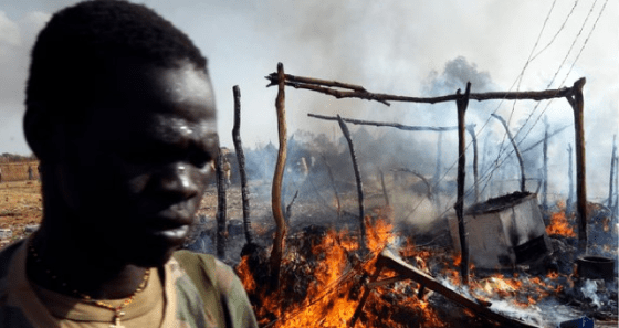 A soldier walked in a destroyed village after Sudanese alleged planes dropped bombs in the region of South Sudan (Photo: Unidentified/Nyamilepedia version)