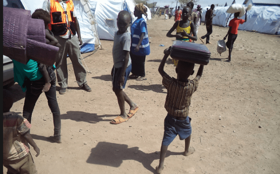 A barefooted little boy who has just arrived at Kenya's Kakuma refugee camp from South Sudan, More South Sudanese returned to refugees camp as the country return to conflict, engineered by its own political elites(Photo: UNCHR/Nyamilepedia version)