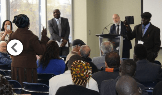 Members of the South Sudanese community gather with the help of facilitators from McMaster University's peace studies program. At the window is Professor Bonny Ibhawoh; at the podium, Dr. Douglas Johnson.(Photo: via Toronto Star)