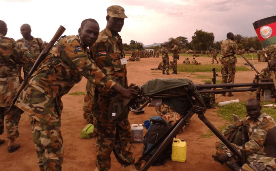The fierce fighter, Elbow Chuol on multiple machines guns during preparation for SPLM/SPLA Conference in Pagak, 2014(Photo: Elbow Chuol/Nyamilepedia)