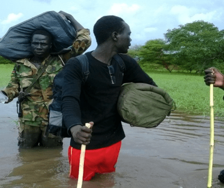 this photo was taken while crossing padoi river jonglei state. it was on the 8th of September 2014 with general Dau Deng Gatkuoth. the photo was captured by friend using my smart phone.