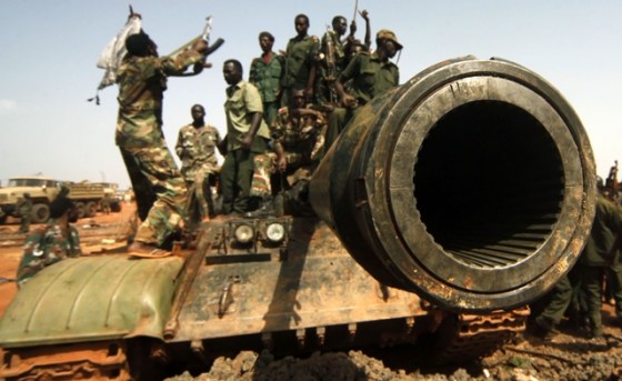 Rebel fighters celebrating the capture of Tanks and other weapons