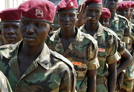 Sudan People's Liberation Army (SPLA) soldiers wait in line to vote during the referendum, at a polling station in SPLA headquarters in Juba, south Sudan January 10, 2011. Southern Sudanese are expected to vote to split from the mostly Muslim north, depriving Khartoum of most of its oil reserves. REUTERS/Goran Tomasevic (SUDAN - Tags: ELECTIONS POLITICS MILITARY)