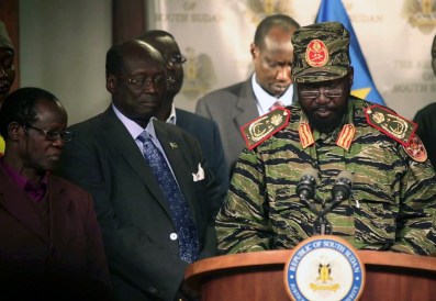 South Sudan's President Salva Kiir (R) addresses a news conference at the Presidential Palace in capital Juba December 16, 2013.