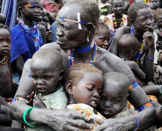 A South Sudanese man protecting his children from an internal conflict(Photo: file)