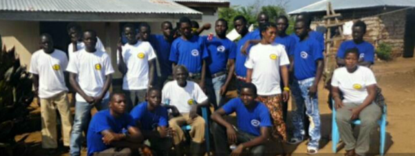 Mr. Druini Jakani, the Executive Director and founder of LCED, posting for a picture with staff members at his head office in Mundri West County(Photo: LCED/Nyamilepedia)