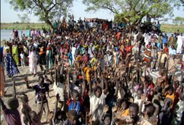 People of Old Fangak welcoming building supplies from USA for Sudan Project(Photo: Sudanmedicalrelief.org)