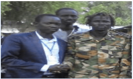 Lou Youth chairperson Yien Wal Lual in suit with Col Bodoang Leah....