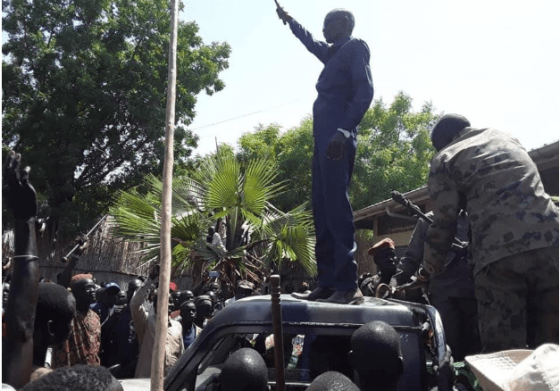 Panyijiar county commissioner, Yohannes Kujiek Ruot Loge waving to the crowd on top of vehicle in Ganyliel Town in 2019(Photo credit: supplied by author)